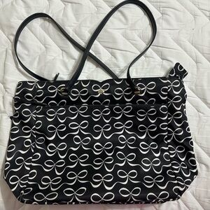 Kate Spade black nylon tote with white bow design.